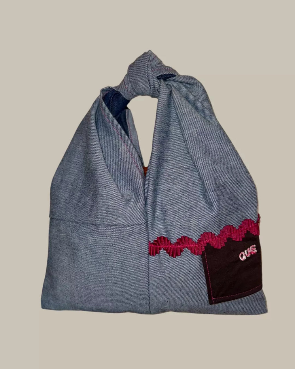 BOLSO DE MANO NUDO DENIM