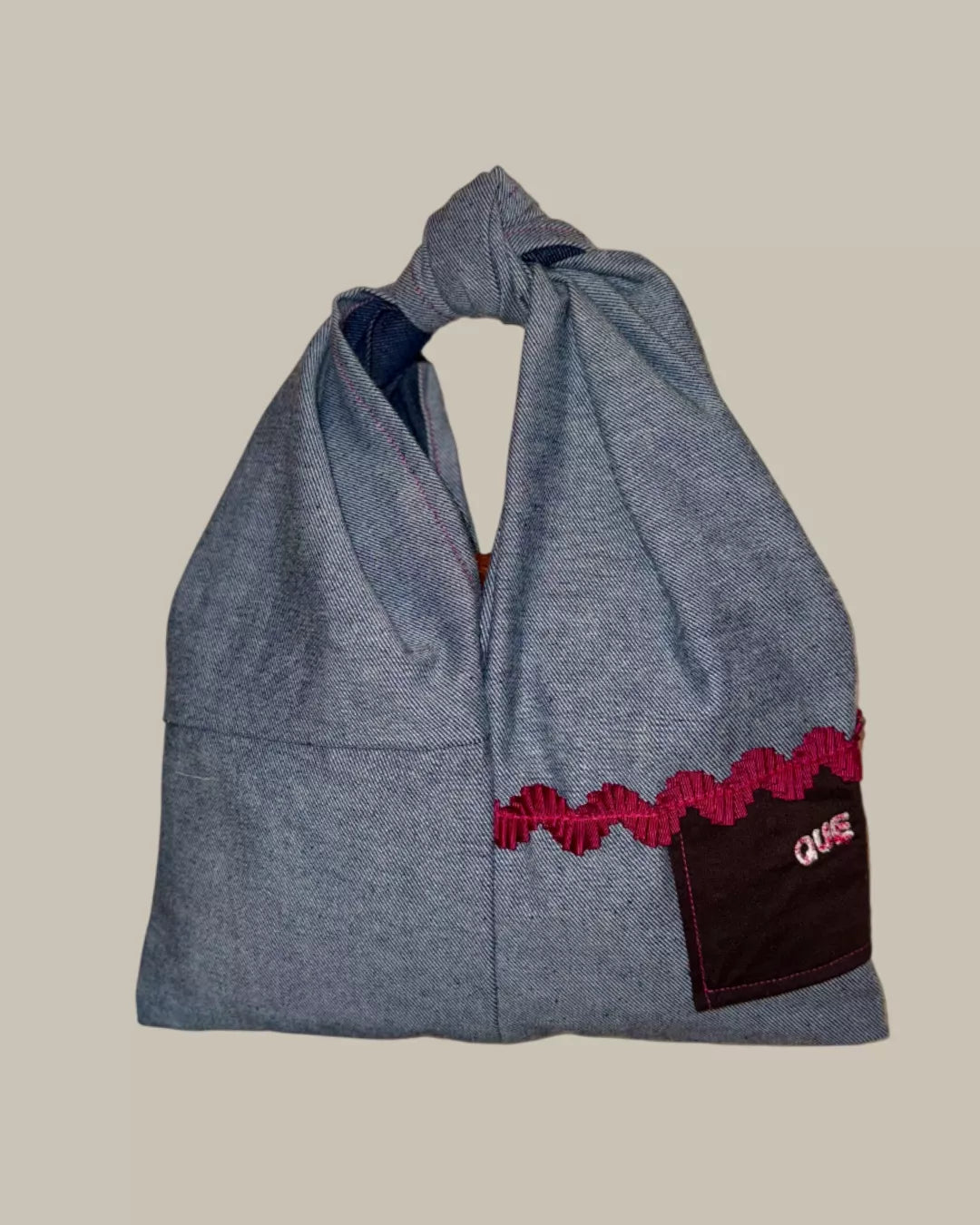 BOLSO DE MANO NUDO DENIM